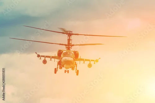 Obraz Wojskowe śmigłowce bojowe wisi w powietrzu.