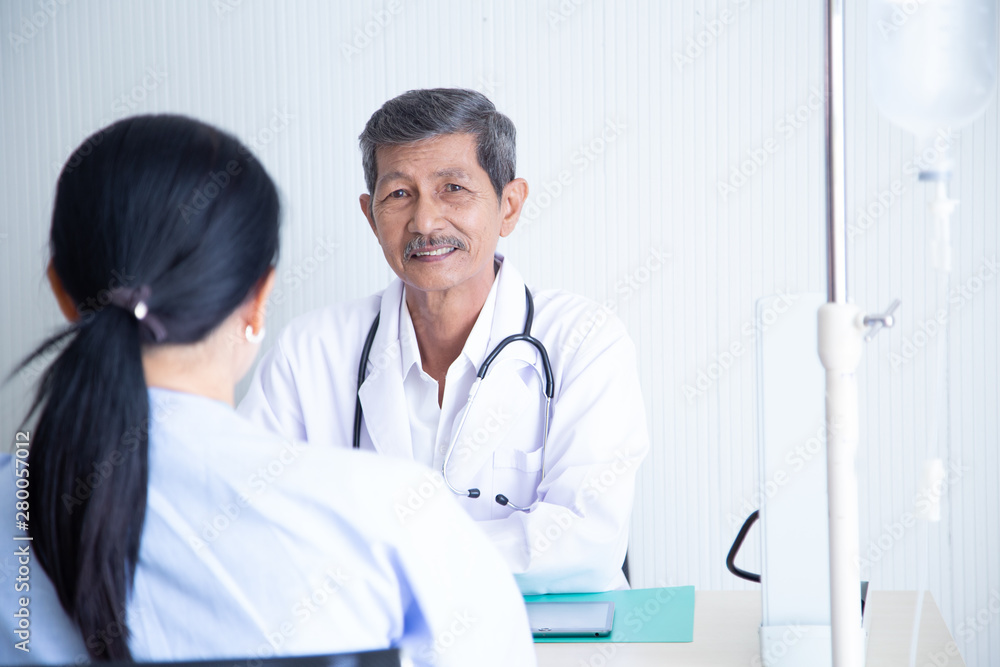 Senior male doctor smile discussing with speaking with his senior patient Senior male doctor smile discussing with speaking with his senior patient