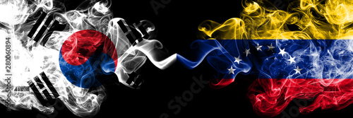 South Korea vs Venezuela  Venezuelan smoky mystic flags placed side by side. Thick colored silky abstract smoke flags of South Korean and Venezuela  Venezuelan