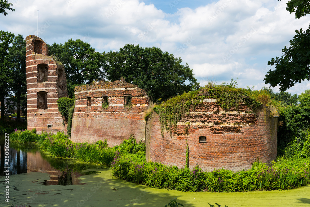 Castle ruin Batenburg, with canal. The Netherlands