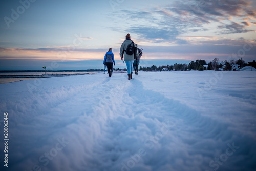 Winter group hiking through snow