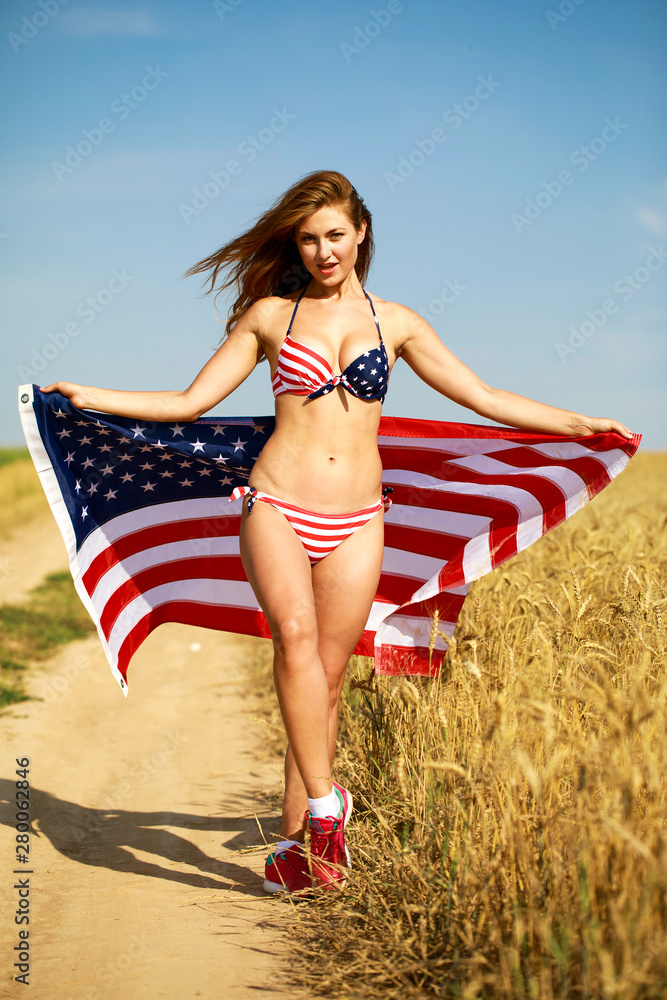 Sexy woman in sexy American flag bikini in a wheat field Stock 写真 | Adobe  Stock