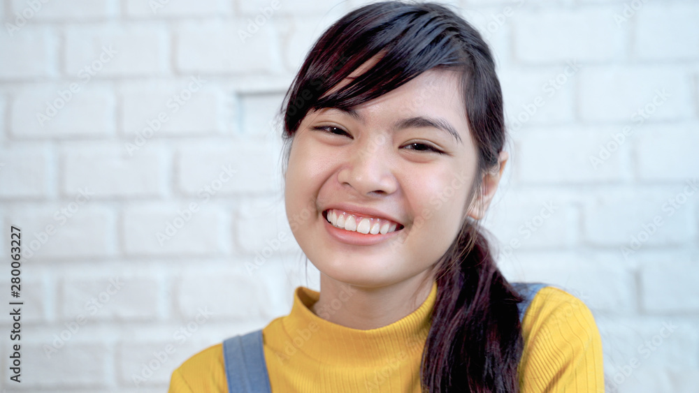 Close up of cute Southeast Asian teenagers are smiling bright and cute Close up of cute Southeast Asian teenagers are smiling bright and cute