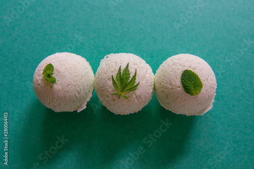 Cannabis bath bombs with mint and marijuana leaf photo