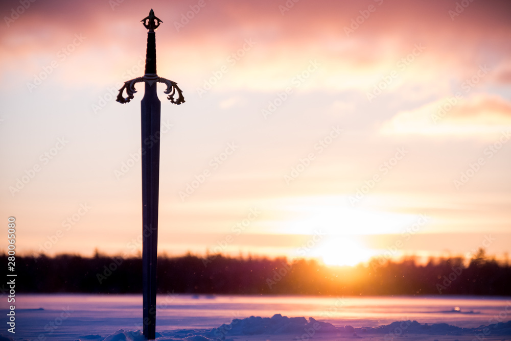 Sword in the snow of the lake