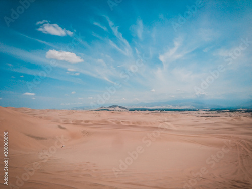 Connect with nature and tourism. Arid desert that connects with a blue sky and sand. 