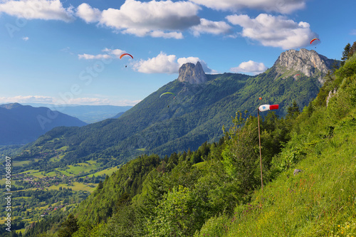 Ppeople doing paragliding from Col du Forclaz, France photo