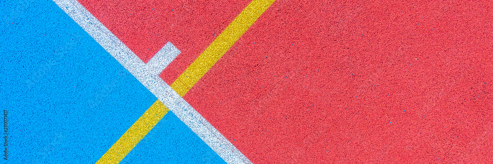 Colorful sports court background. Top view to red and blue field rubber ground with white and yellow lines outdoors - obrazy, fototapety, plakaty 
