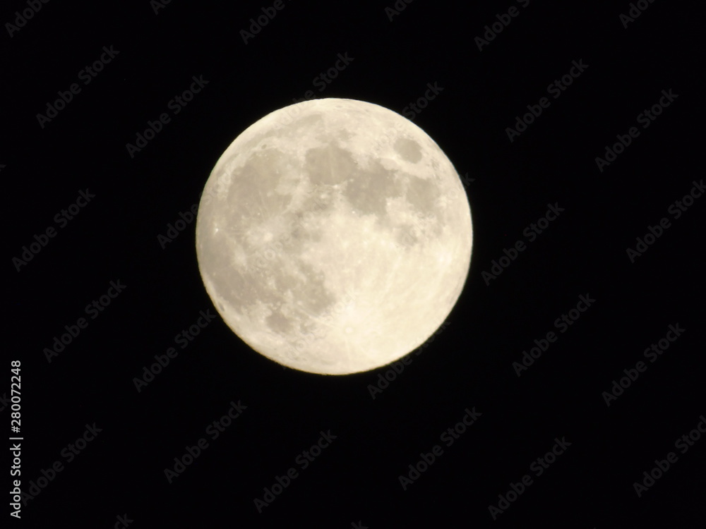 An amazing photography of the full moon over the city of Genova by night with a great clear sky in background and some stars An amazing photography of the full moon over the city of Genova by night with a great clear sky in background and some stars