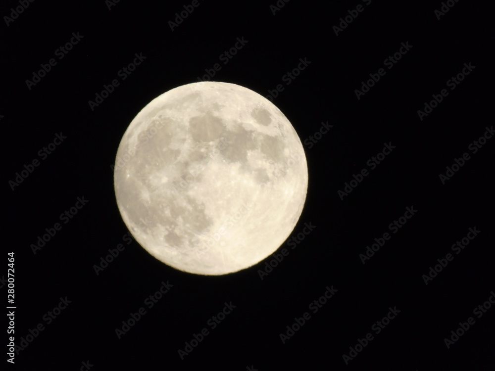 An amazing photography of the full moon over the city of Genova by night with a great clear sky in background and some stars An amazing photography of the full moon over the city of Genova by night with a great clear sky in background and some stars