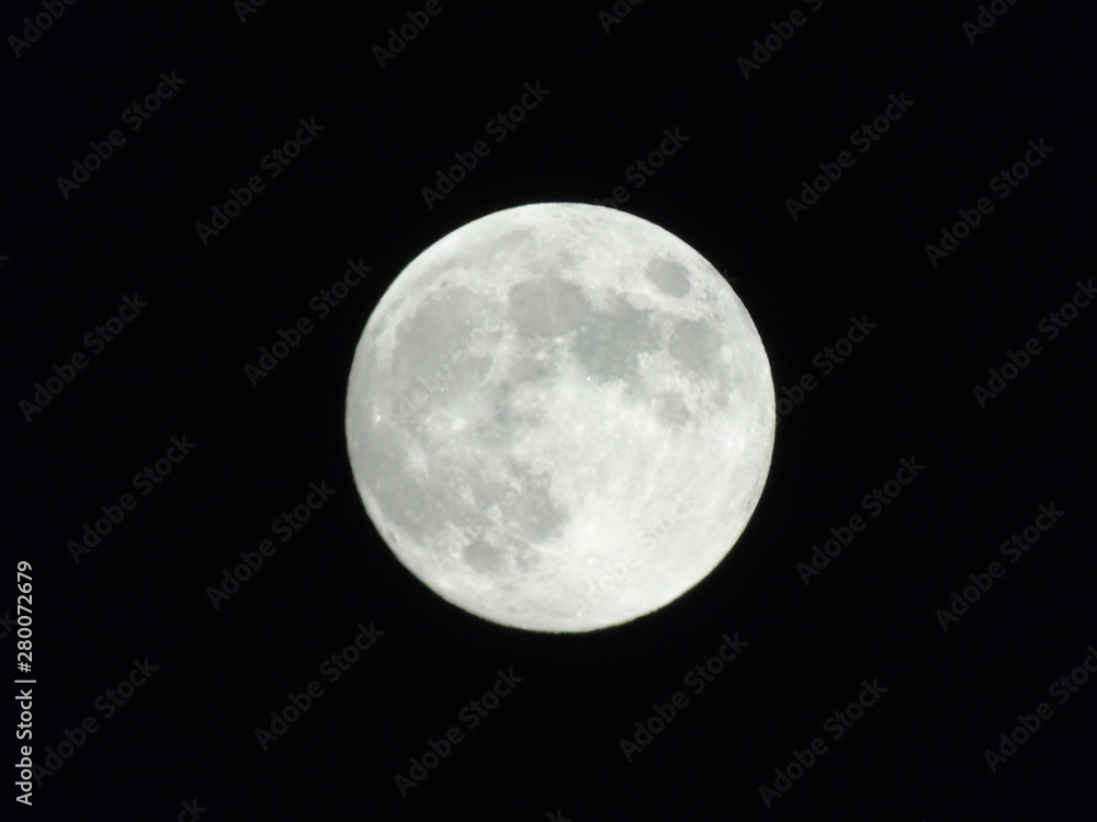 An amazing photography of the full moon over the city of Genova by night with a great clear sky in background and some stars An amazing photography of the full moon over the city of Genova by night with a great clear sky in background and some stars