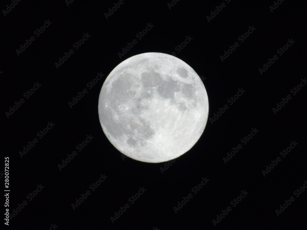 An amazing photography of the full moon over the city of Genova by night with a great clear sky in background and some stars An amazing photography of the full moon over the city of Genova by night with a great clear sky in background and some stars