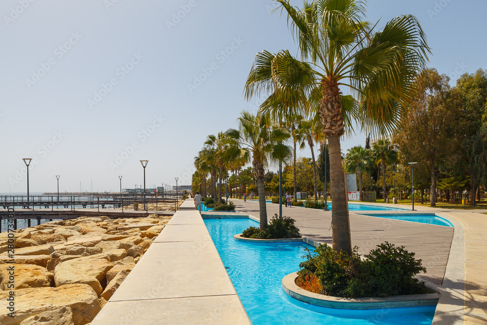 LIMASSOL, CYPRUS - MAY 10, 2018: Molos promenade on the coast of Limassol city in Cyprus, day time