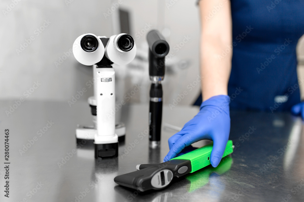 Professional equipment of a veterinary doctor ophthalmologist - manual slit  lamp, ophthalmoscope, veterinary tonometer..Blurred Background Stock Photo  | Adobe Stock