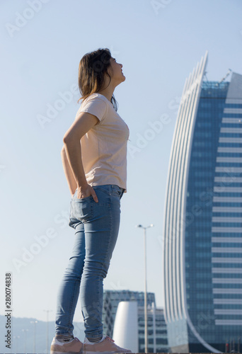 Young girl and skycreaper