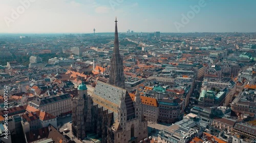 VIENNA, AUSTRIA - JUNE, 2019: City skyline aerial shot. Cathedrals and cityscape. Significant tourist sites from above photo