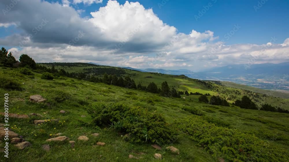 Stunning timelapse of clouds moving over the green valley of La Cerdanya, in the Pyrenees mountains, Spain