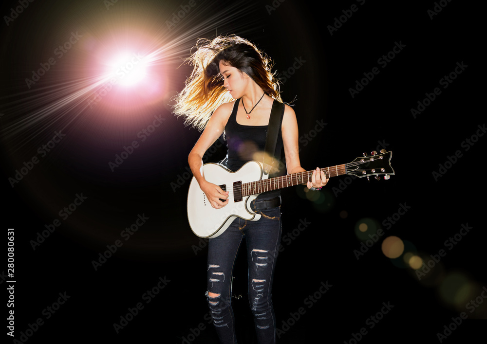 Young and beautiful rock girl playing the electric guitar Young and beautiful rock girl playing the electric guitar
