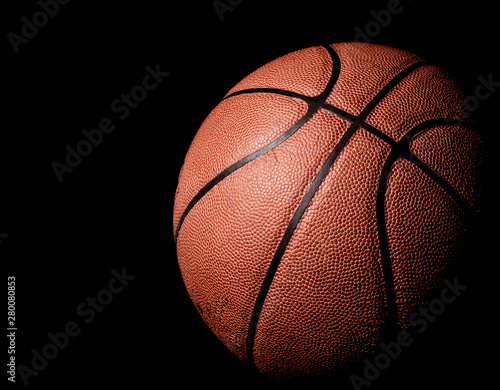 basketball on black background © erik