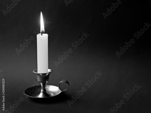 a single candle in a candlestick