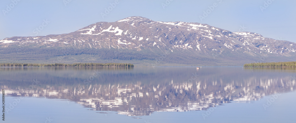 panorama with mountain reflects in the lake