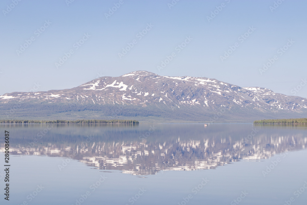 sweden alps with reflection in calm lake
