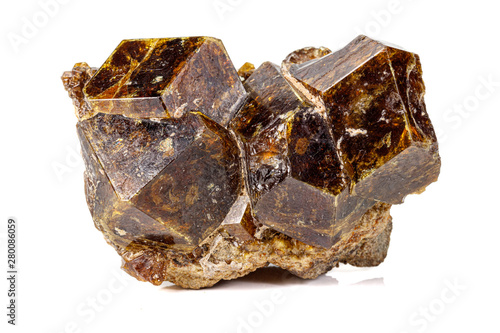 Macro stone Grossular mineral on white background photo