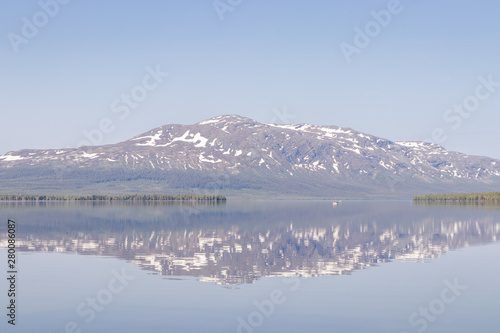 sweden alps with reflection in calm lake © annaia