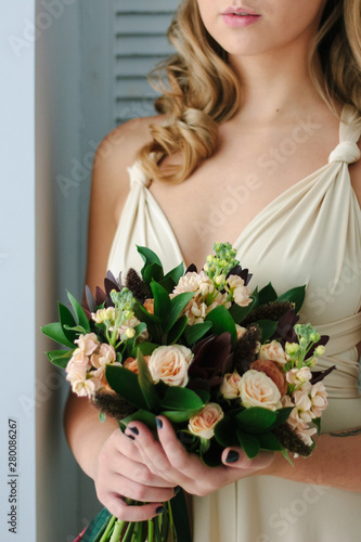 Woman in beautiful dress ho...