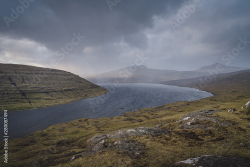Moody landscape lake Faroe Islands