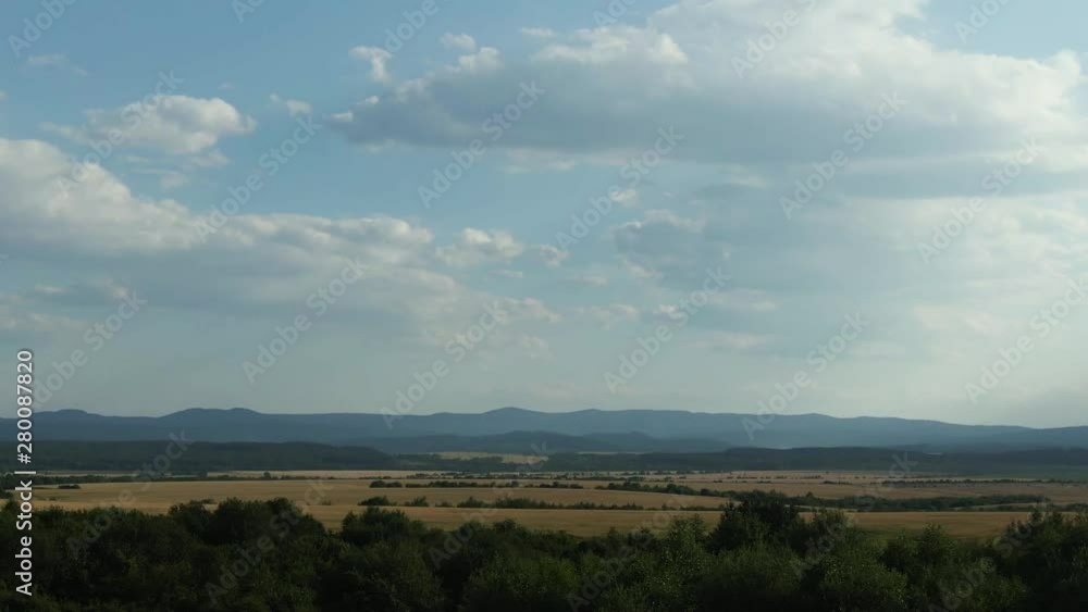 Flying from the field over forest and the mountains, hills. Flying from the field over forest and the mountains, hills.