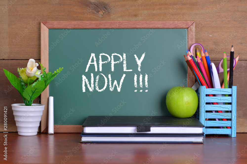 Green school chalkboard with written sentence APPLY NOW Green school chalkboard with written sentence APPLY NOW