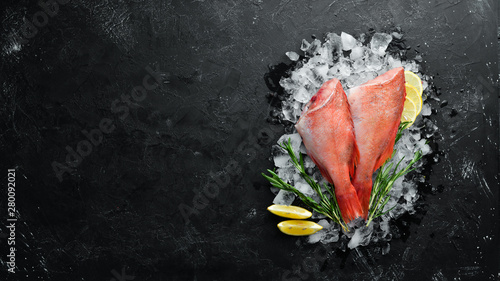 Seafood raw snapper on ice. Top view. Free space for your text.