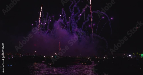 Slow motion of majestic salute in the sky of the redeemer venice Redentore holiday festival fireworks in Venice Italy with offshore yachts. photo