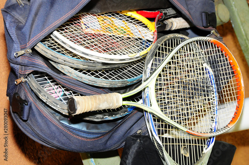 varies worn and worn tennis rackets photo