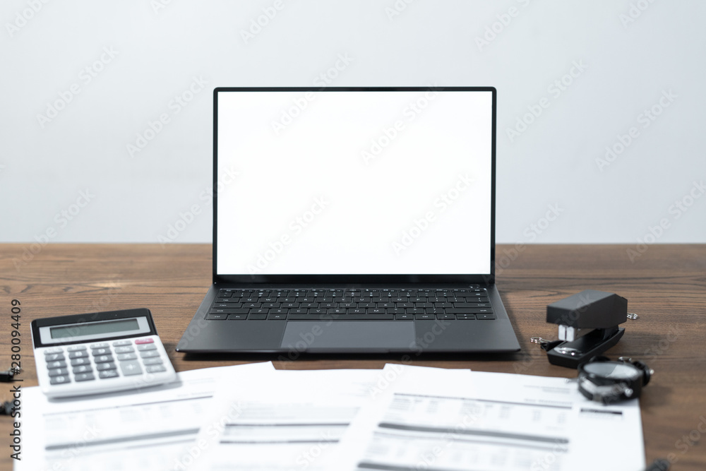 Modern laptop and documents on wooden table Modern laptop and documents on wooden table
