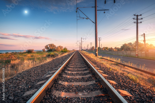 Fototapeta Railroad and blue sky with moon at sunset