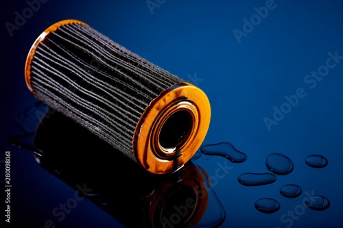 car engine oil filter on dark background photo