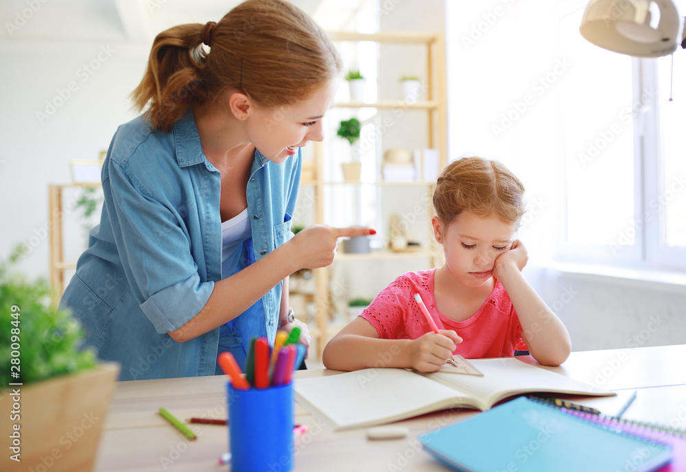mother scolds a child for poor schooling and homework . mother scolds a child for poor schooling and homework .