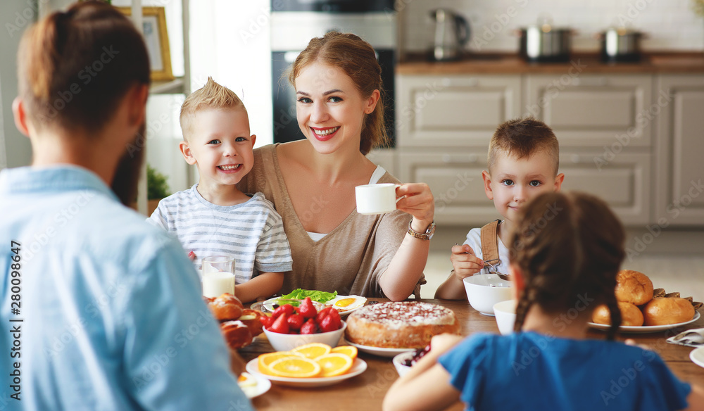 family mother father and children have Breakfast in kitchen in morning. family mother father and children have Breakfast in kitchen in morning.