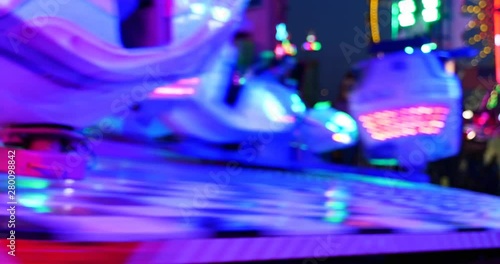 Blur night amusement atmosphere with illuminating blue light at 