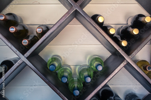 Obraz na płótnie Wine bottles on a rack getting better with time. w salonie