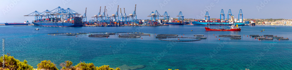 Marsaxlokk. Panoramic view of the cargo port and port water area. Marsaxlokk. Panoramic view of the cargo port and port water area.
