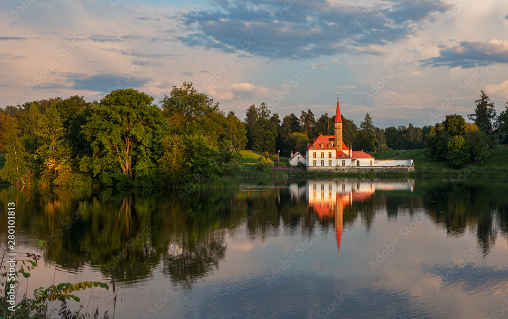 Evening summer landscape with a lake and a Palace. Gatchina