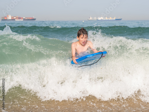 Child with body board