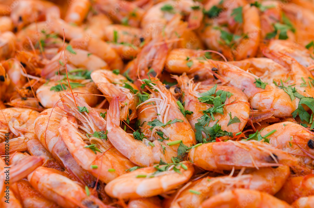 Fresh hot cooked shrimp with wine sauce and parsley