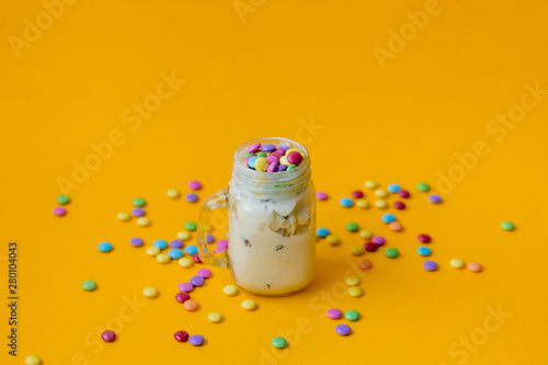 Cup of cream ice-cream with candy in dragee