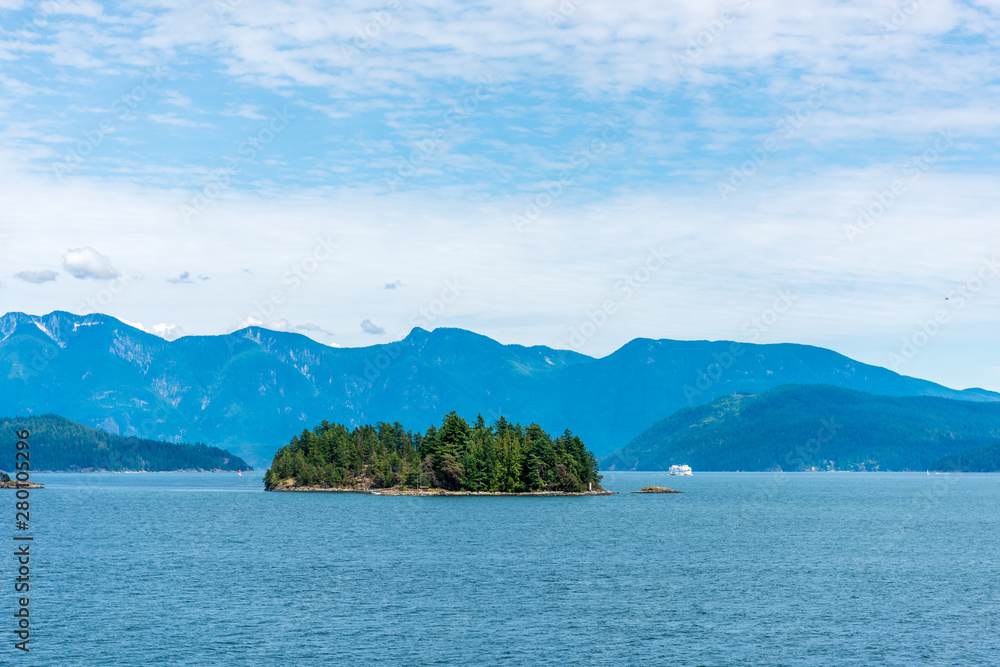 View over Inlet, ocean and island with mountains in beautiful British Columbia. Canada.