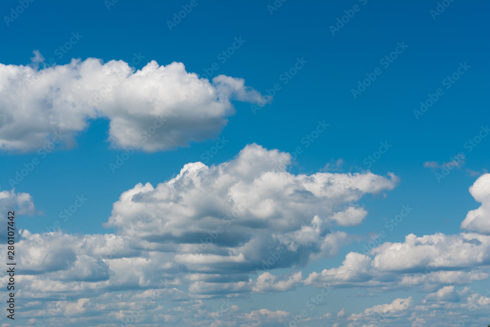 White, Fluffy Clouds In Blue Sky. Abstract Background From Clouds. White, Fluffy Clouds In Blue Sky. Abstract Background From Clouds.