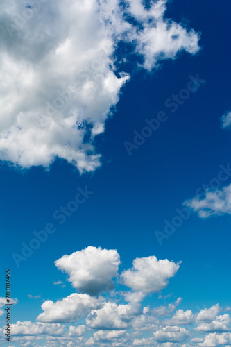 White  Fluffy Clouds In Blue Sky. Abstract Background From Clouds.